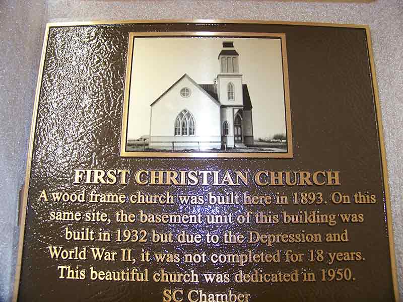 building dedication plaque in bronze with metal portrait